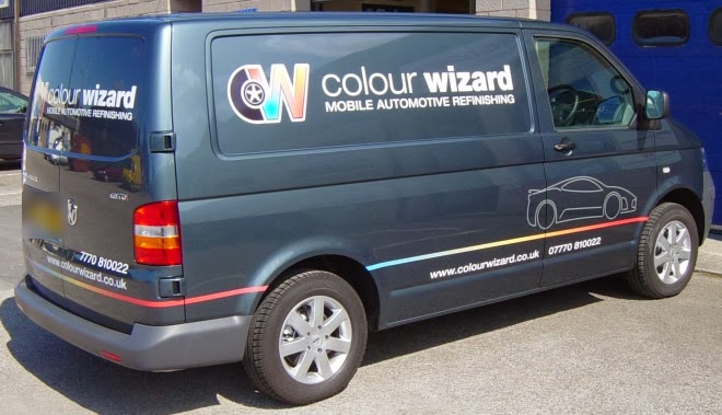 The Colour Wizard van in its grey livery with the rainbow pinstripe