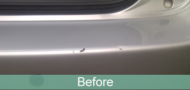 Silver rear bumper, before repair