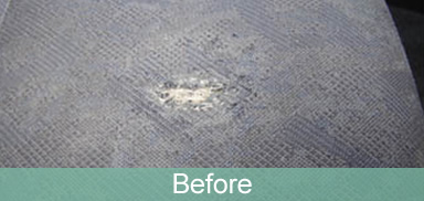 Fabric seat burn, before repair
