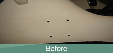 Drilled interior trim, before repair